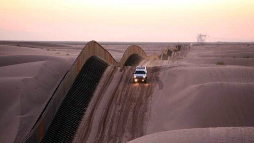 California border along Algodones sand dunes | photo via CALmatters
