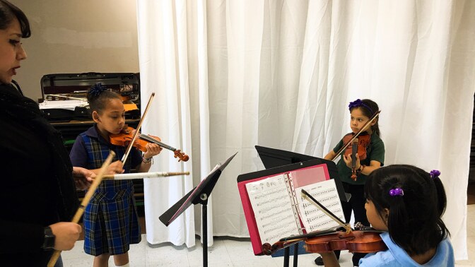 Esperanza Juarez at an introduction to violin class. | Courtesy of Richard Mata