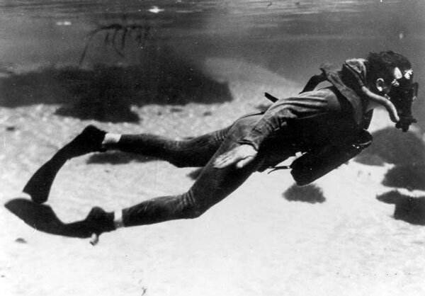 A member of the OSS's Maritime Unit swims underwater with an early SCUBA device and flexible fins developed specially for the clandestine service. Courtesy of the Catalina Island Museum.