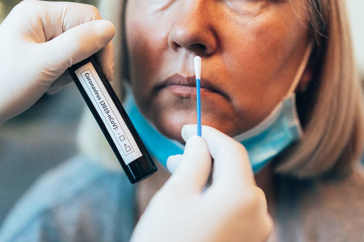 A woman is swabbed to test for COVID-19 | iStock