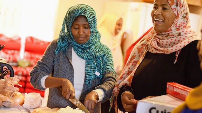 Two participants of Bilal and Baraka preparing food. | Courtesy of United Women of East Africa Support Team