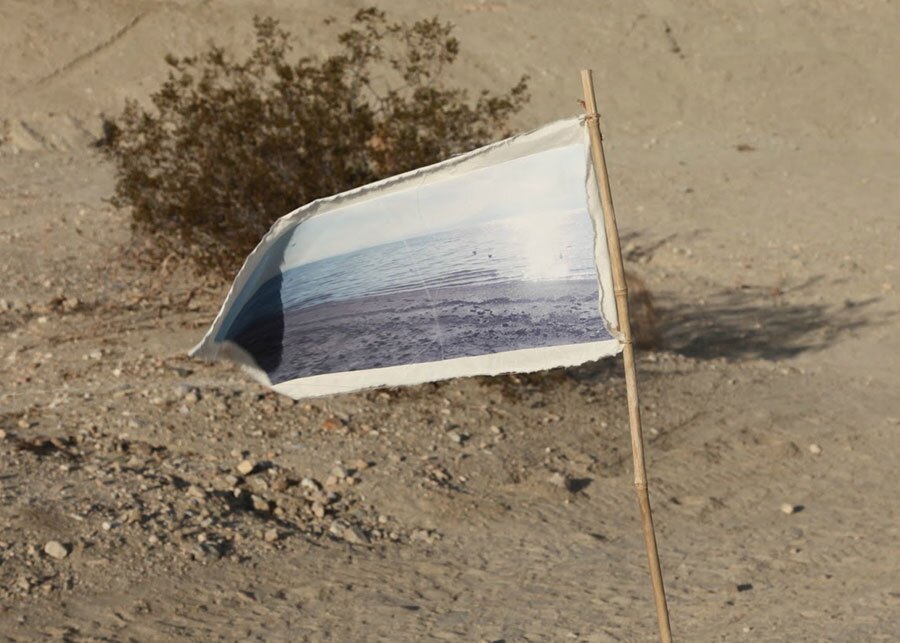 A flag emblazoned with an image of water | Photo: Drew Tewksbury
