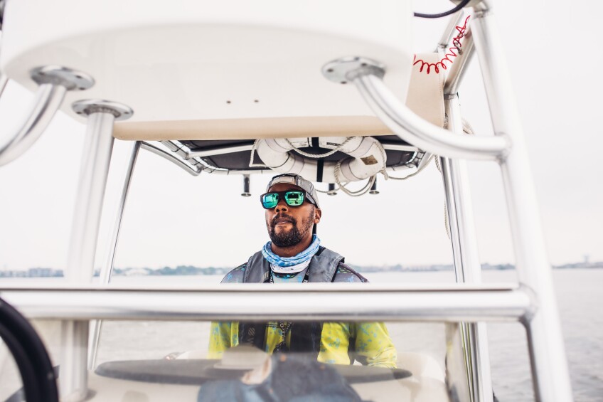 Captain Fred stands on his fishing boat.