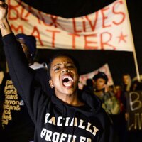 Demonstrators shout slogans during a march in St. Louis, Missouri, on November 23, 2014 to protest the death of 18-year-old Michael Brown. Photo by: JEWEL SAMAD/AFP/Getty Images