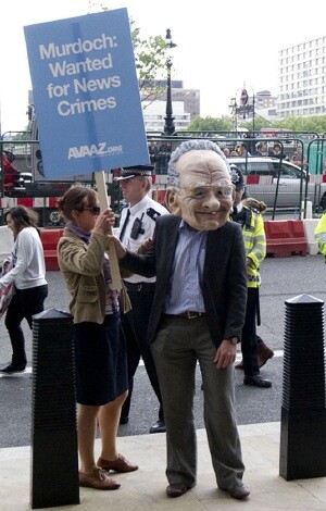 Protestors gather outside Portculis house as the Home Affairs Select Committee heard evidence in London, on July 19, 2011, on the phone-hacking scandal. CARL COURT/AFP/Getty Images