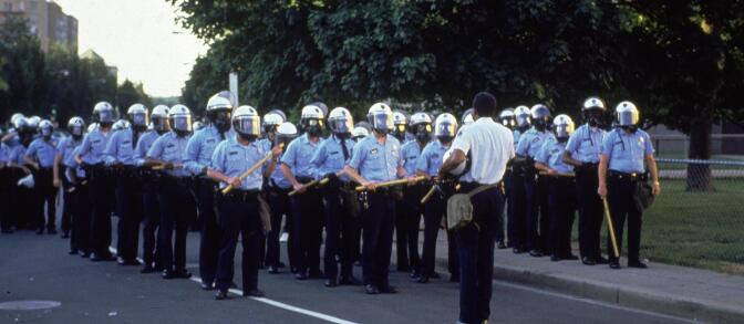Washington, D.C., April 1992: Police officers stand in formation, wearing helmets and holding clubs, during the riots following the 'not guilty' verdict in the beating of Rodney King.