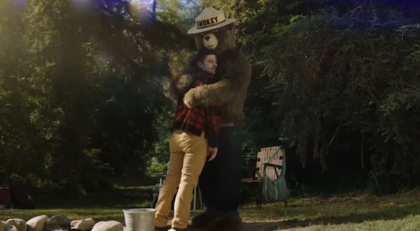 Smokey Bear now gives out bear hugs to those who prevent wildfires. | Photo: Screenshot of Ad Council commercial.