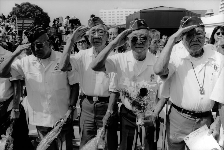 Japanese-American veterans execute salute at WWII memorial in Little Tokyo, Los Angeles