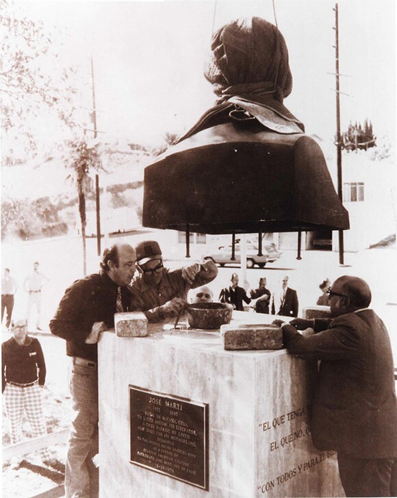 Sergio López-Mesa, architect Pablo Ruiz, and civil engineer Carlos Sebastian Lorente installing José Martà Monument, 1976. | Cuban California Archive USC Libraries Special Collections.