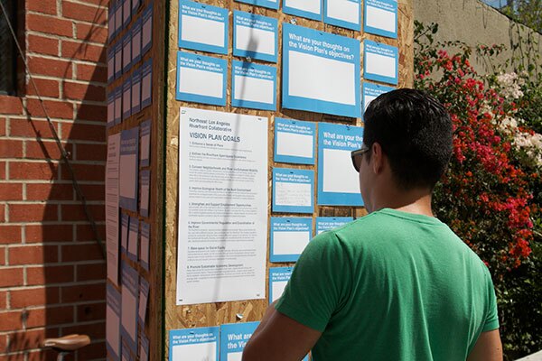 Attendees wrote down their thoughts on the vision plan at the kiosk.