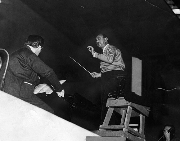 Arnold Schoenberg conducts the Los Angeles Philharmonic Orchestra in a rehearsal for a 1935 concert. | Courtesy of the Herald-Examiner Collection, Los Angeles Public Library.