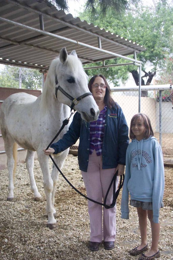 Robinson with her her nine-year old granddaughter Kaela Harris and 17-year-old horse Zacky.