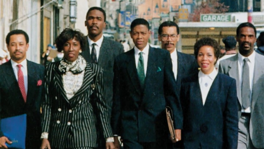 A group of African American people wearing business attire walk together on a city street. | From "Black America Since MLK: And Still I Rise"