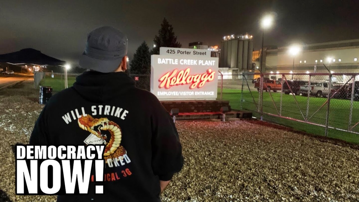 A man looks at a sign that reads, "Battle Creek Plant: Kellogg's."