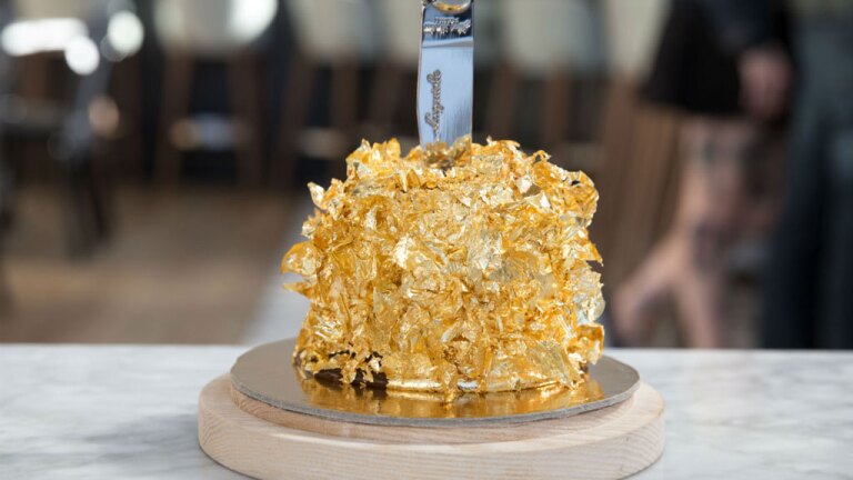 Jumbo Apple dessert enveloped in gold leaf from Kimpton Everly Hotel