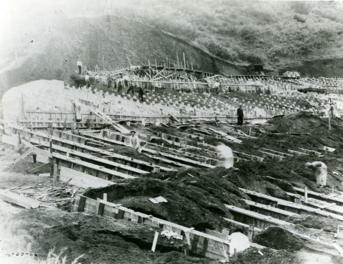 Workers scattered across construction area for installation of benches at the Hollywood Bowl, April 30, 1926. | Los Angeles Philharmonic Archives