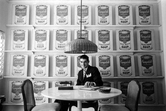Irving Blum with Andy Warhol's Campbell's Soup Cans at the Ferus Gallery in Los Angeles, 1962. Photo by William Claxton.