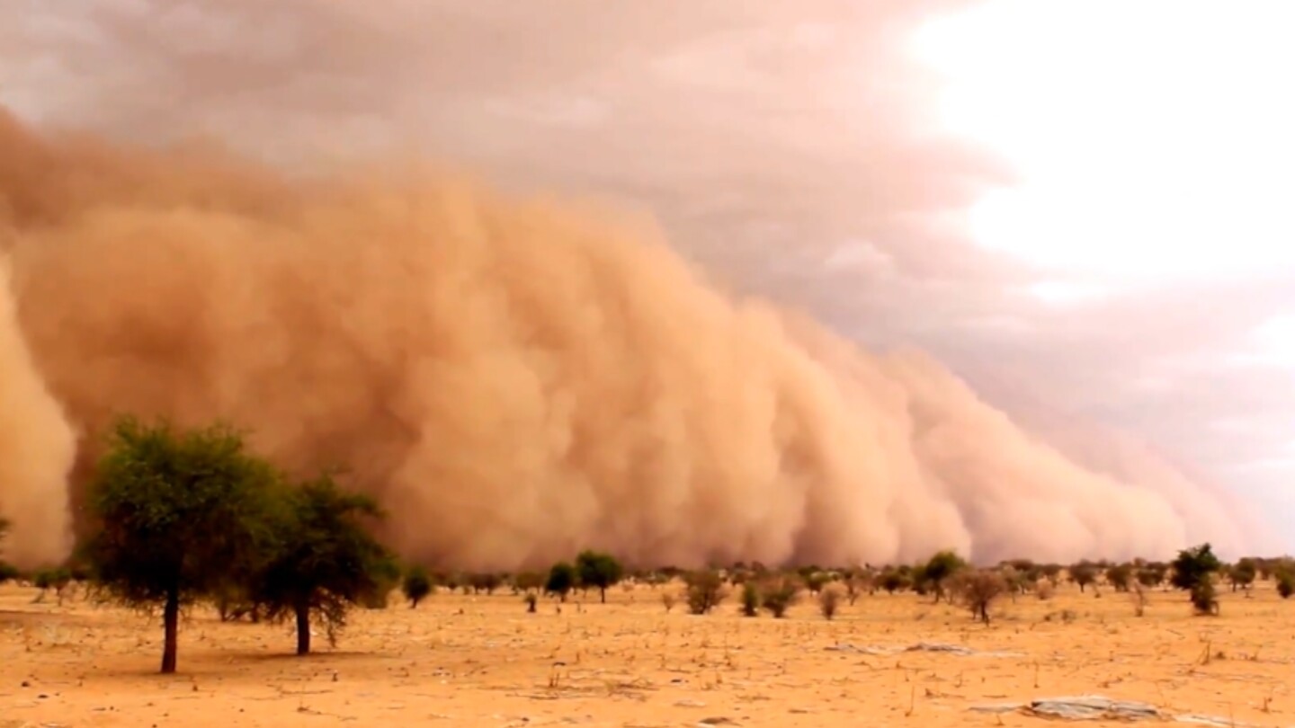 A dust storm gathered in the distance.