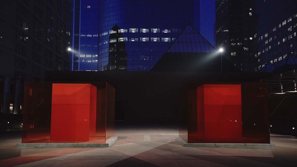 Larry Bell's "Bill and Coo at MOCA’s Nest" is a work of Light and Space art. Here it is seen at night. | Still from Artbound "Light & Space" ab s11