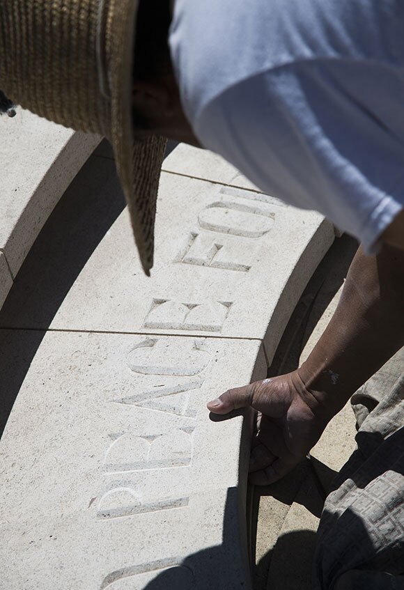 Nacacio Aparicio works on the new 'Armenian Genocide Memorial' in Pasadena, California on April 17, 2015, before the official unveiling and dedication ceremony the following day. | ROBYN BECK/AFP/Getty Images