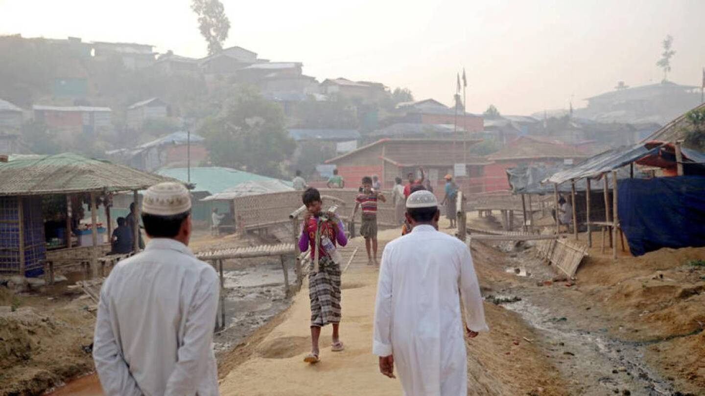 FILE PHOTO: Rohingya refugees walk on a road at the Balukhali camp in Cox's Bazar, Bangladesh, April 8, 2019. | REUTERS/Mohammad Ponir Hossain/File Photo