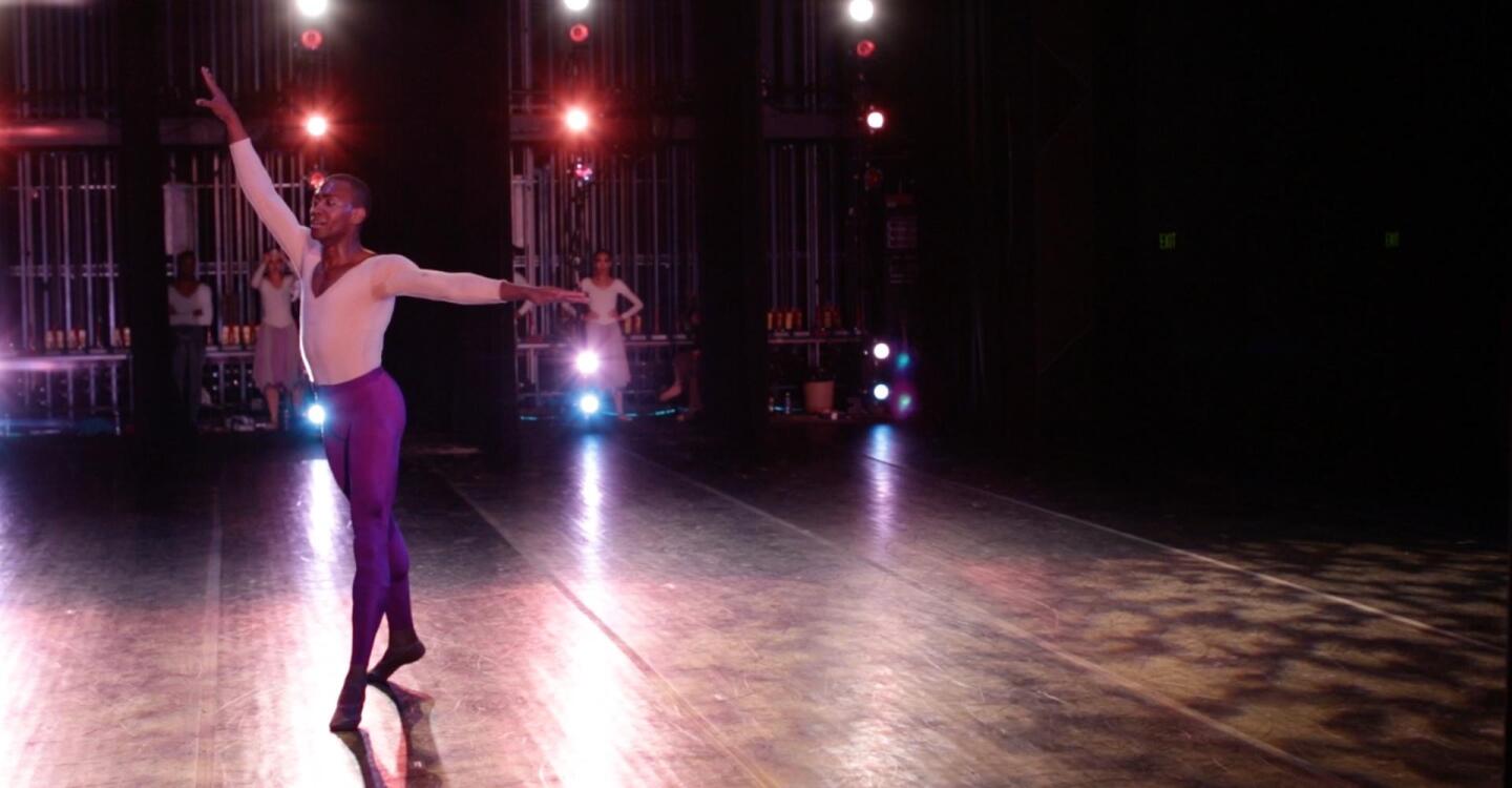 Fredrick Davis extends his arms during a performance.