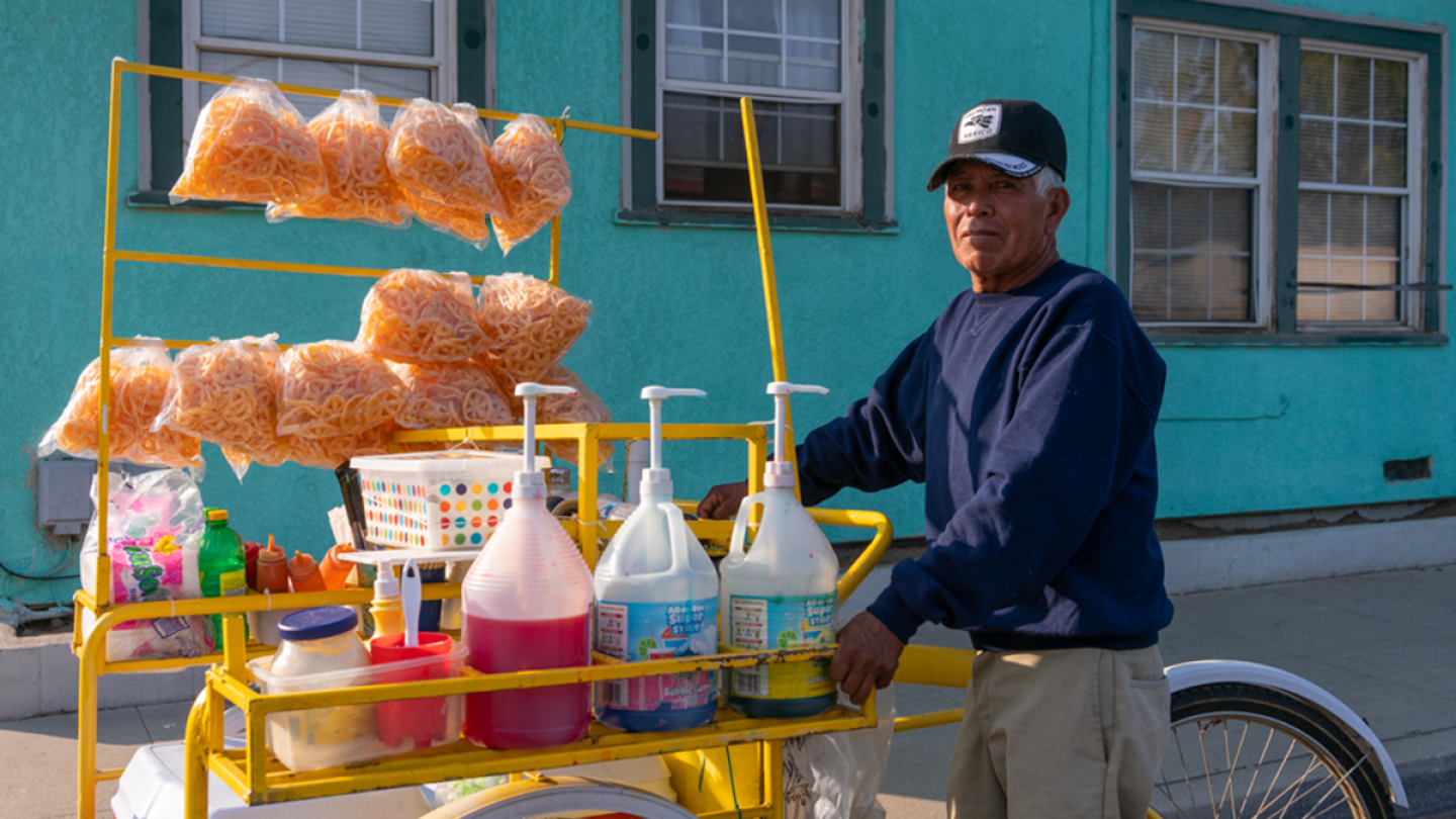 Manuel Hernandez is a streeet vendor selling snacks on a bike-operated vehicle on the streets of Fresno. | Neil Chowdhury