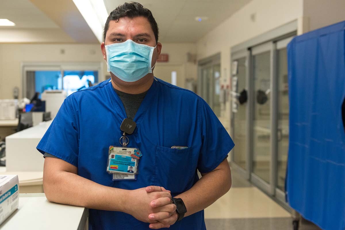 Nurse Jonathan Magdaleno says it’s been stressful working in the COVID ICU at LAC+USC Medical Center. “I grew up in this community,” he says. “You see your parents, you see your grandparents in these patients.” | Heidi de Marco/California Healthline