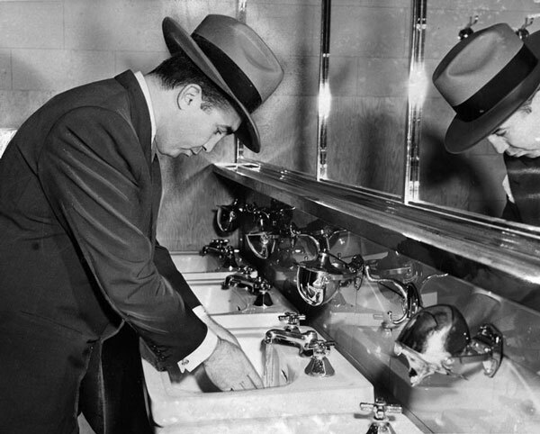 Cohen was a compulsive hand-washer whose habit was often recorded by newspaper photographers. Courtesy of the Herald-Examiner Collection, Los Angeles Public Library.