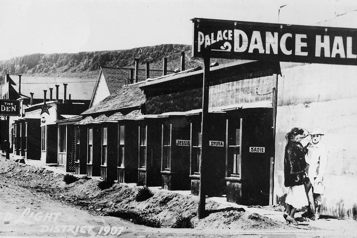 Exterior of the Palace Dance Hall (a brothel). Sadie, Sylvia and Jessie are listed at the entries of three “cribs” where these women did business. | Courtesy of University of Nevada, Reno, Special Collections.