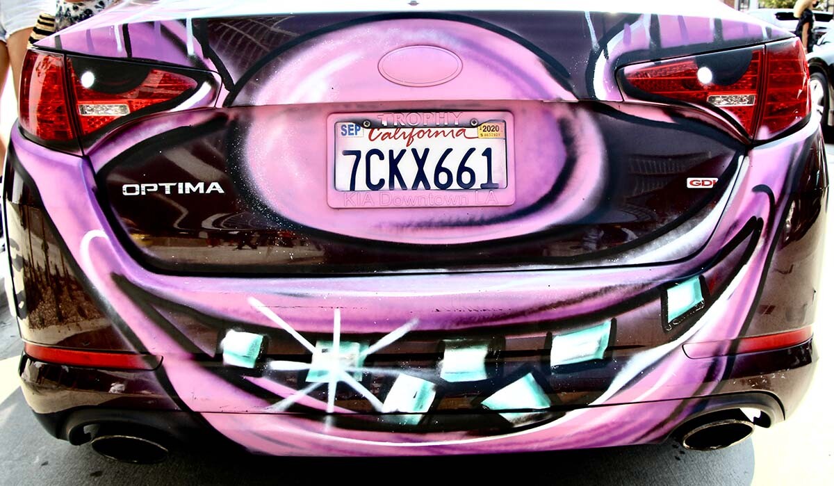 A smiling face painted by Kenny Scharf for his "Karbombz!" car parade September 26, 2020 | Jordan Riefe