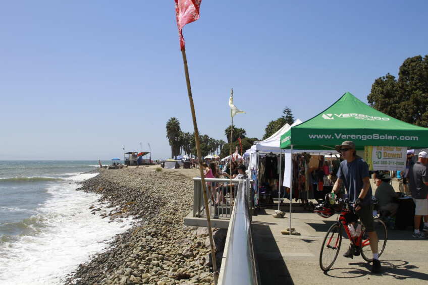 Aloha Beach Festival 2026, photo of market tents on a boardwalk next to the ocean shore 