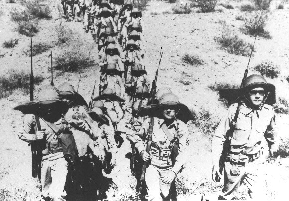 Troops march through the landscapes of the Desert Training Center. | Photo by Bill Threatt, courtesy of the General Patton Memorial Museum.