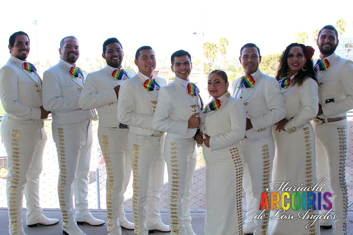 Marachi Arcoiris de Los Angeles members Natalia Melendez, Mayra Martinez, Rodolfo Vasquez, Allan Lopez-Vasquez, Valentin Tril Jr., Pablo Juarez, Brian Espinoza and Carlos Samaniego, pose together. | Courtesy of Carlos Samaniego