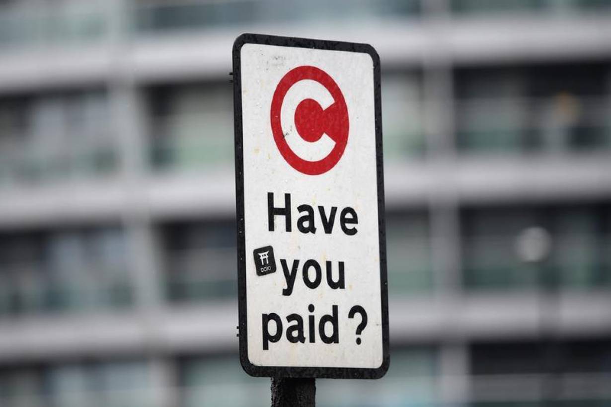 ARCHIVE: A sign indicating the beginning of the congestion charging zone in London, Britain, January 31, 2018. | REUTERS/Toby Melville
