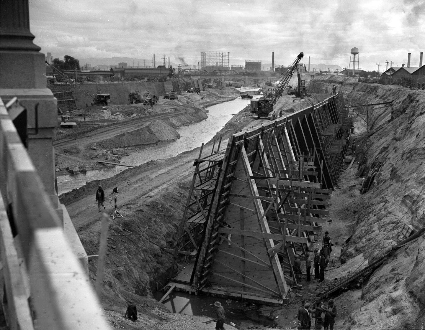 Workers building framing for concrete and digging during reconstruction of Los Angeles River, Calif., 1938
