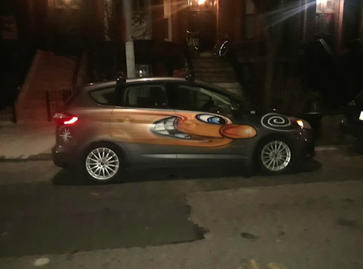 A small gray car bombed by Kenny Scharf for his "Karbombz!" project | Courtesy of the artist