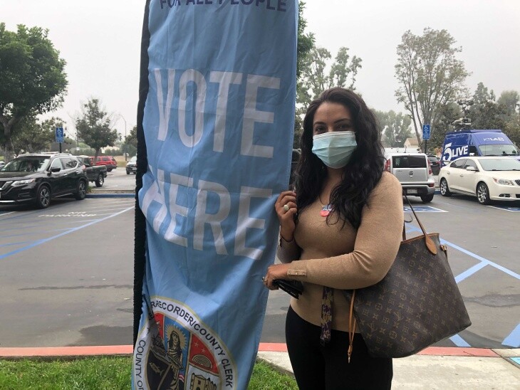 Maryam Danishwar, 39, votes in her first election at the L.A. Registrar in Norwalk. | Carla Javier/LAist