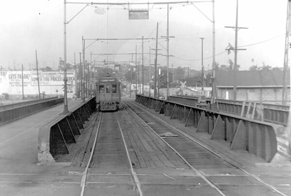 A streetcar crosses the Aliso Street bridge over the Los Angeles River. Courtesy of the Metro Transportation Library and Archive.