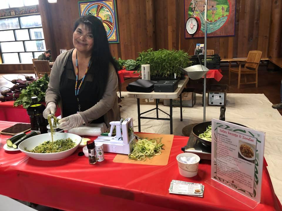 A Potawot staff member preparees a spiralized zucchini recipe for a taste test. | Courtesy of Potawot Community Food Garden's Facebook page