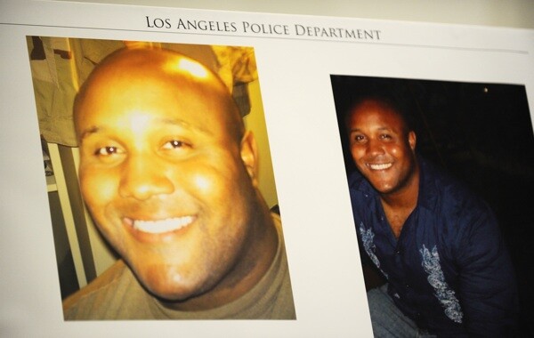 Photos of fired Los Angeles Police Department officer Christopher Dorner are seen at a press conference regarding the manhunt for Dorner. Photo: Robyn Beck/AFP/Getty Images)