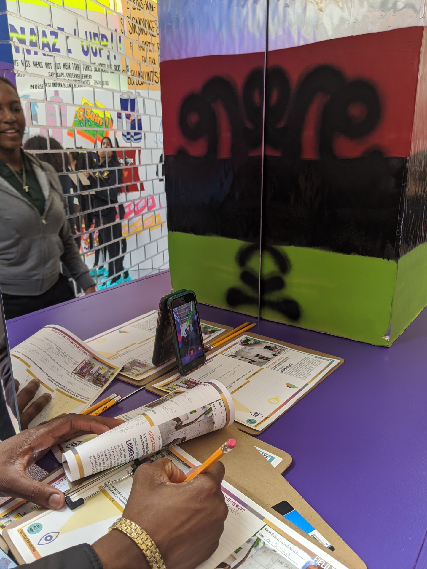March 2020_Lauren Halsey Field Trip_student writing about art.jpg