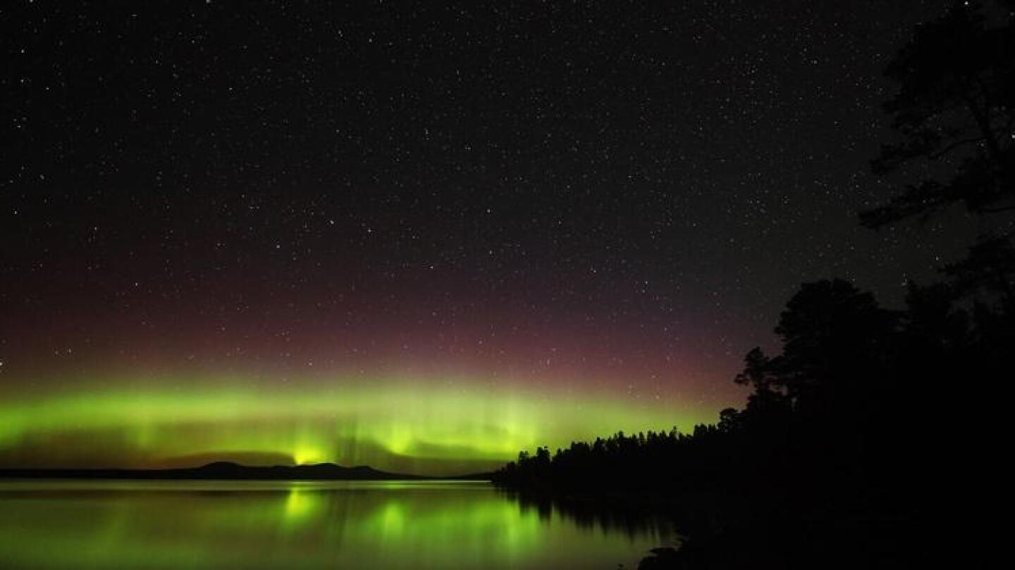 The aurora — a ghostly flicker and colorful glow.