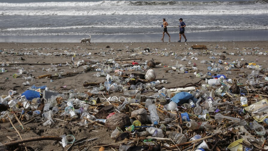 Plastic trash on Berawa Beach, Bali, Indonesia.