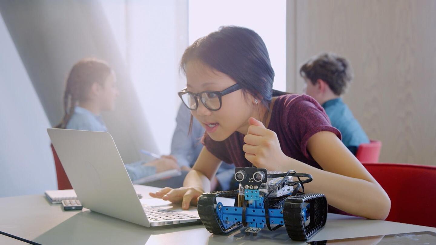 girl-with-laptop-and-robot