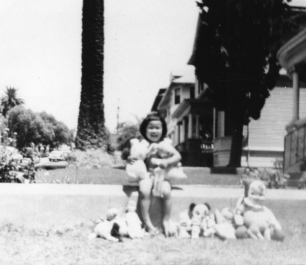 Hawaiian Girl playing with dolls on Bonnie Brae. Courtesy of Los Angeles Public Library