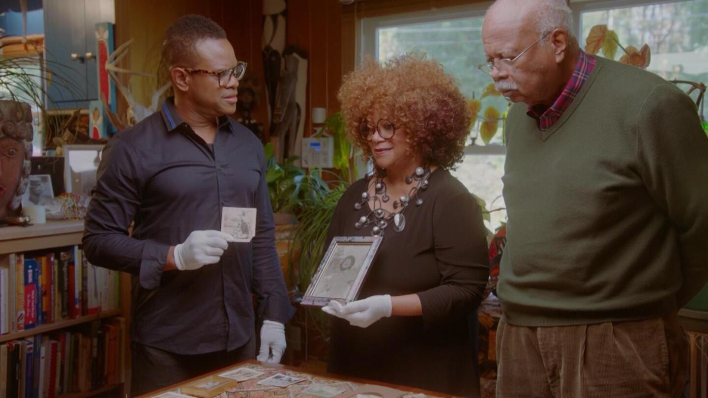 Host Thomas Allen Harris listens to a woman speaking about her family photo. | "Family Pictures USA: North Carolina"