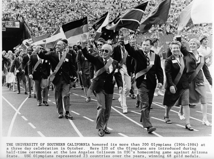 Lee marches with other USC Olympians in 1984