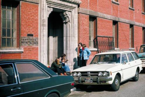 Sheila de Bretteville, Helen Alm Dawn, and Cheri Gaulke outside the front door on Spring Street, Fall 1975 | Photo: Woman's Building Image Archive