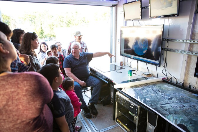 Christopher Kitts in the mobile mission control center during a recent outreach event. | Courtesy of R. Mike Rasay